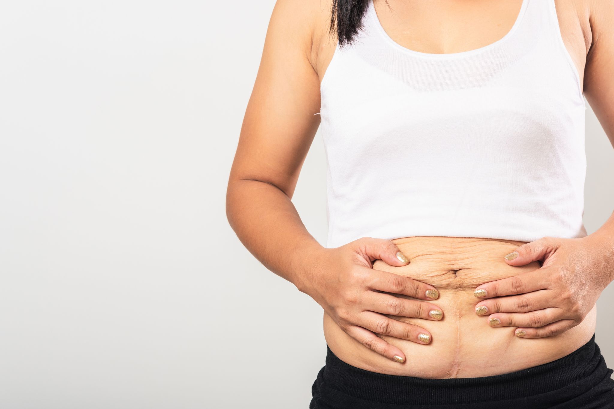 Změny ženského těla po porodu. Foto: ©Canva